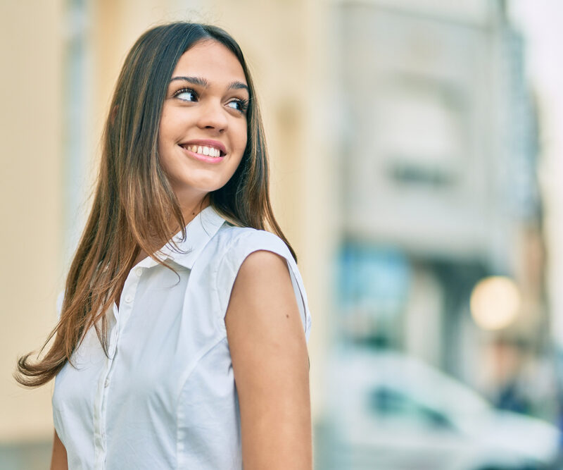 Smiling woman representing confidence after gum care in the Bethesda, MD community