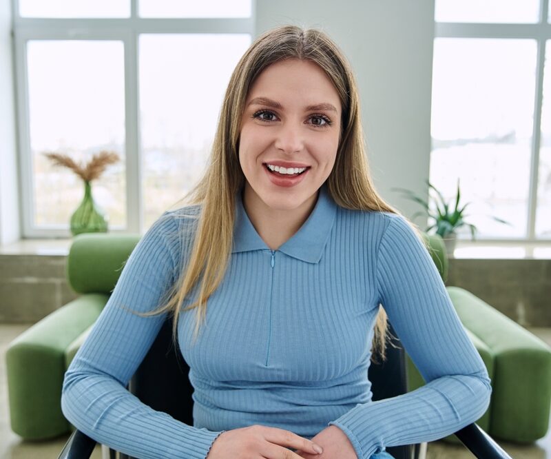 Smiling woman showing her teeth before a wisdom teeth evaluation at a dental office in Bethesda, MD