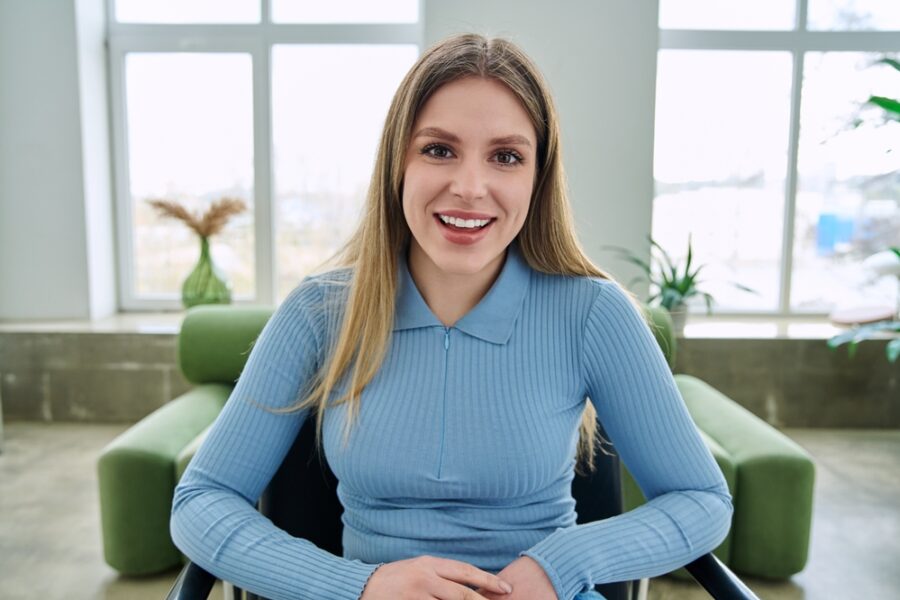 Smiling woman showing her teeth before a wisdom teeth evaluation at a dental office in Bethesda, MD