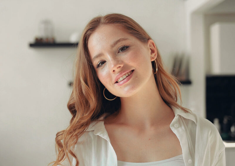 Smiling woman showing healthy teeth after following a cavity prevention routine in the Bethesda, MD community